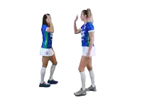 two female soccer players high five each other with the number 3 on their shirts