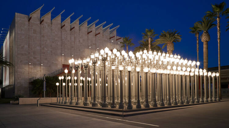 Pose in front of streetlights at LACMA