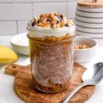 Snickers overnight oats in a mason jar.