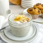 vanilla chia pudding topped with almonds and honey in a mason jar.