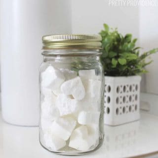 heart shaped toilet bombs in a mason jar on a bathroom counter