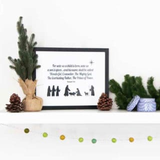 Nativity Printable with bible quote with Christmas decor on a white shelf