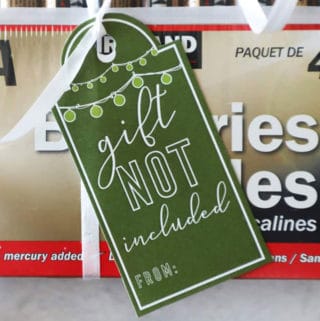 green gift tag for batteries that says 'gift not included'