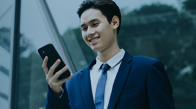 A professional businessman looking at his phone