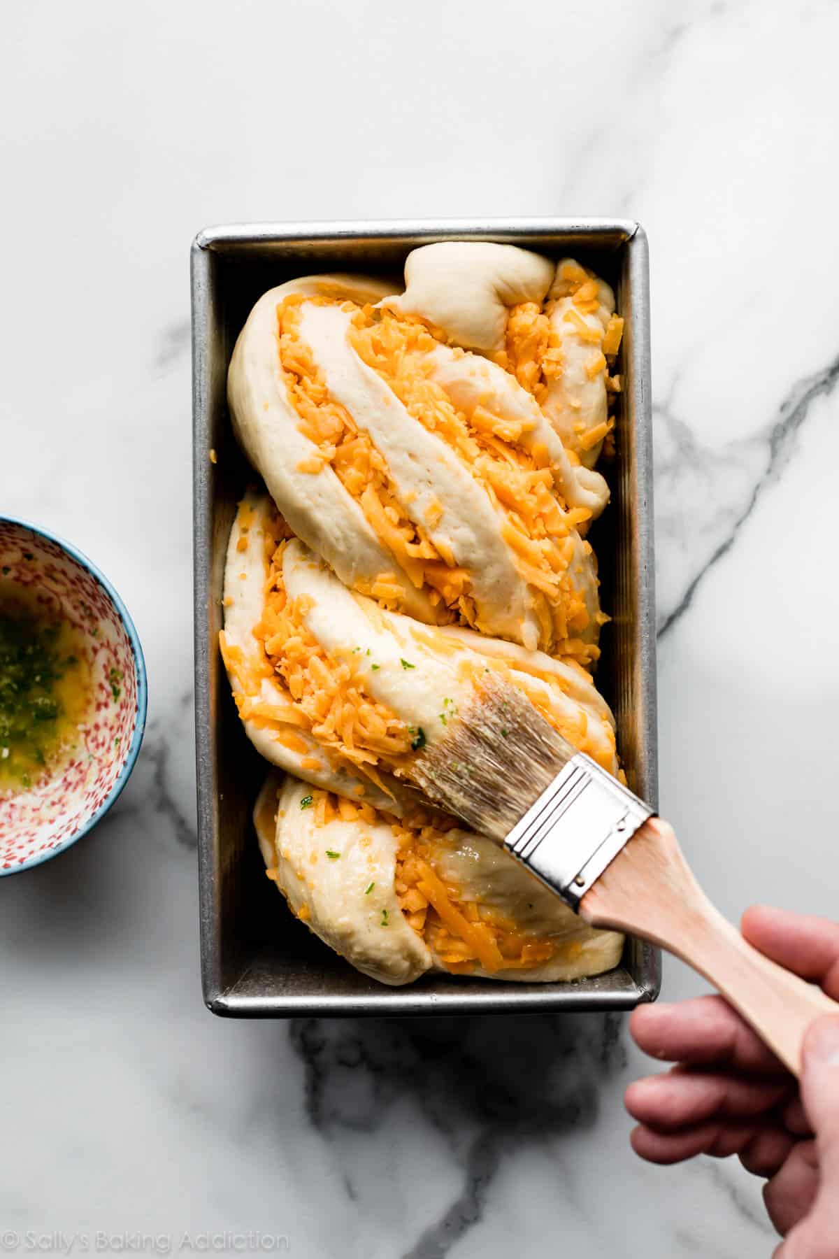 cheese bread dough in loaf pan