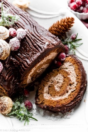 sliced yule log with chocolate ganache and meringue mushrooms