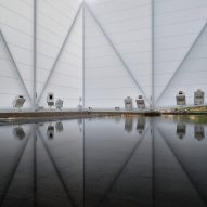 Visitors wade through water in the Brazilian Pavilion at Expo Dubai 2020