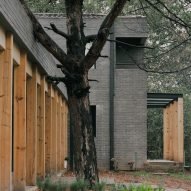 Domestico Estudio clads house with grey brick in Mexican forest