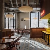 Ménard Dworkind combines bold yellows with muted tones in Montreal restaurant