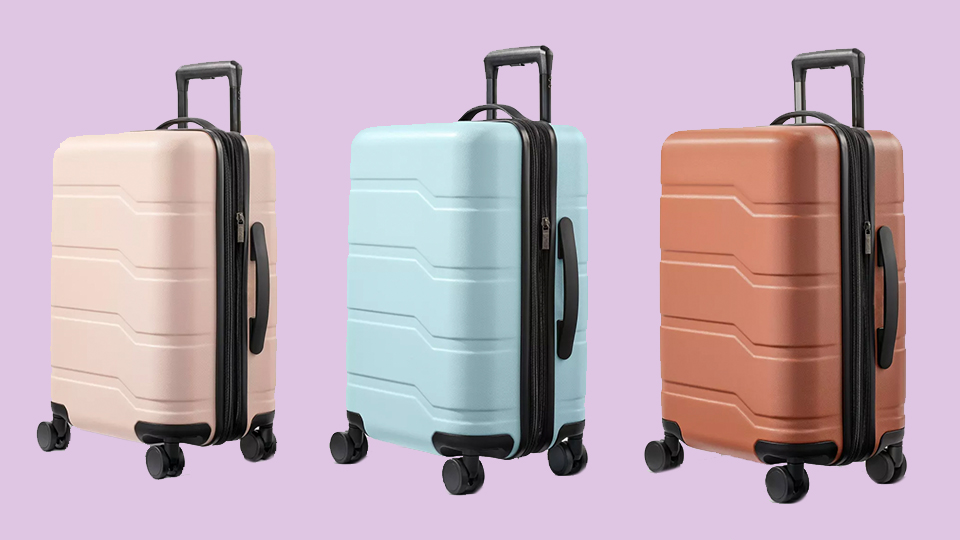 Open Story Hardside Carry On Spinner Suitcase in Pink, Muddy Aqua, and Amber Brown.