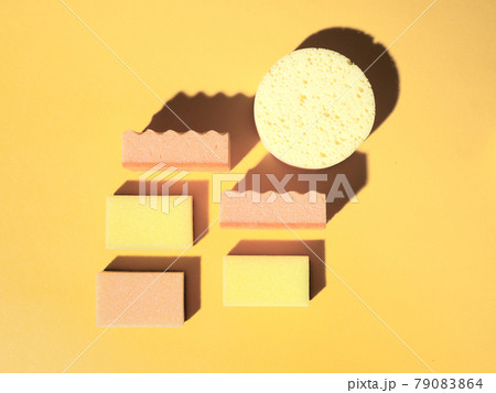 Geometric pattern with domestic sponges on orange 79083864