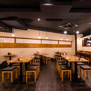 A spacious store with a total of 75 seats at counters and tables.