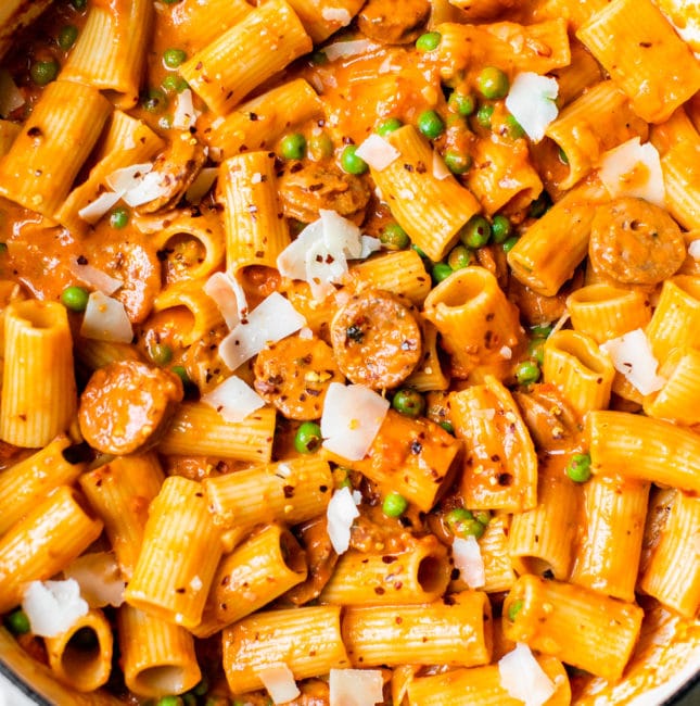 pasta, peas and sausage in a skillet