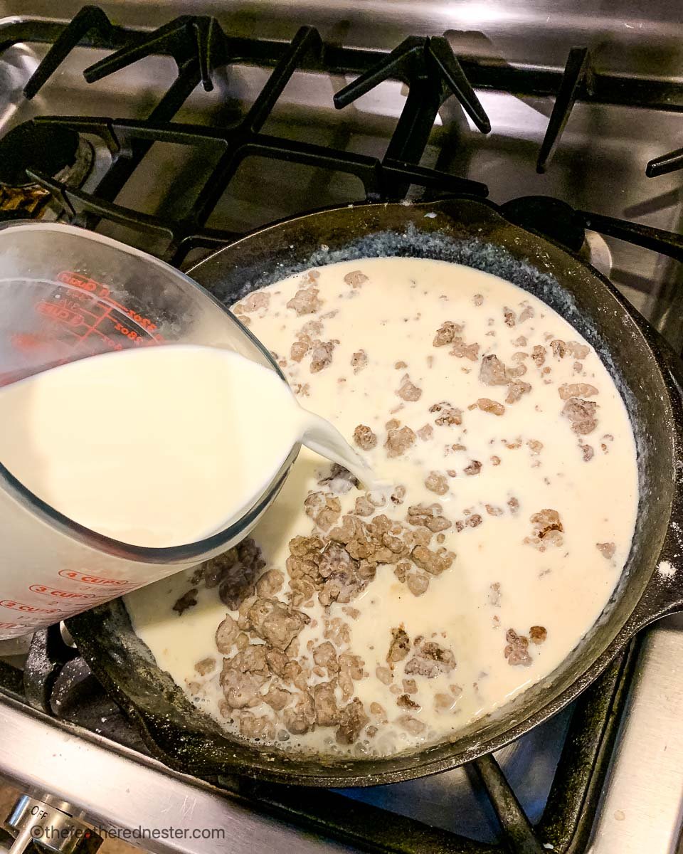 pouring milk into a cast iron skillet.