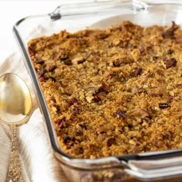 Overhead shot of finished sweet potato casserole in glass baking dish.