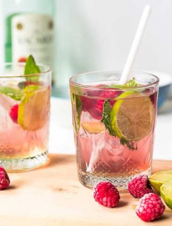 Raspberry mojito cocktails with Barcadi rum, raspberries, syrup and Pellegrino