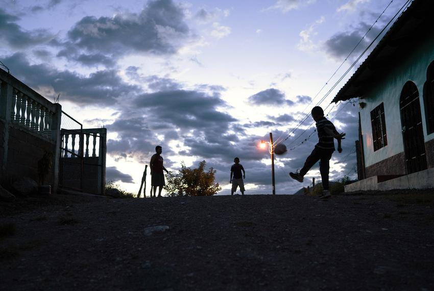 Children play near Carlos' family home in Olancho, Honduras.