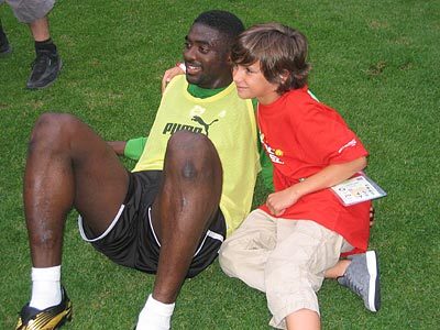 File:Toure With a Young Fan.jpg