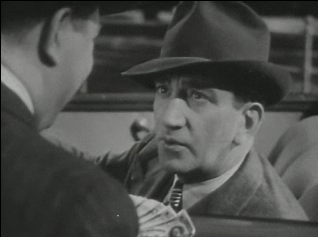 File:John litel in Little Miss Thoroughbred trailer.png