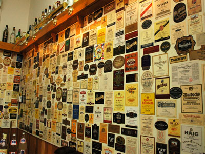 File:Wall of Scotch Whisky Lables.jpg