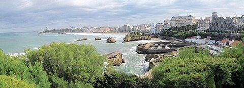 Fishing port, beach, and lighthouse