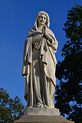 Restored Statue of Mary dusk in Gdów Cemetery