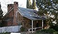 Blundells' cottage, built in the 1860's next to the Molonglo River, now on the bank of Lake Burley Griffin