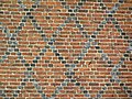 Wall decorated with black, strongly fired bricks (castle in Radzyń Chełmiński, Poland)