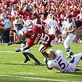 Oklahoma Sooners wide receiver Ryan Broyles falls into the end zone in a game against the Tulsa Golden Hurricane in 2009.