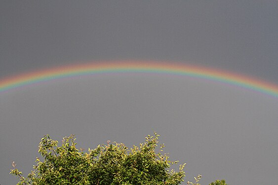 Rainbow with all colours after thunderstorm