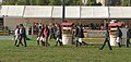 French riders walking a show jumping course