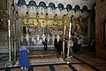 Murals facing the Stone of Anointing.