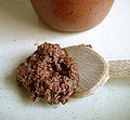 A spoon with Tapenade (mashed olives and other ingredients) (France)