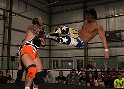 Sanada dropkick.jpg