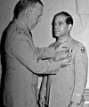 Frank Capra receives the Distinguished Service Medal from General George C. Marshall, 1945