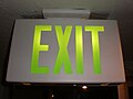 Light green neon exit sign