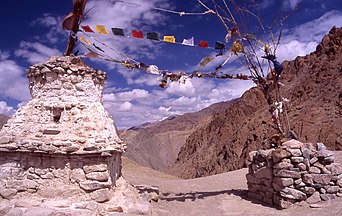 Pass in Ladakh with the typical Buddhist prayer flags and chorten