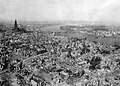 Cologne Cathedral stands nearly undamaged while entire area surrounding it is completely devastated. Railroad station and Hohenzollern Bridge lie damaged to the north and east of the cathedral.