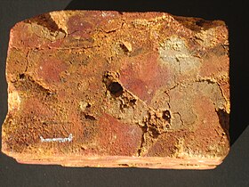 Sample of laterite brickstone, Angadipuram, India (scale:1cm)