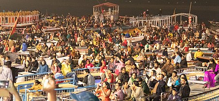 People watching evening Ganga Aarti from the riverside