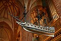 * Nomination A ship model hanging from the ceiling. The ship model is an copy of the original "votivskeppet" and made in 1950s. The original ship model was built around 1600, it is now in the Museum of Maritime History and was given to the church as a sacrifice. The ship-type is an Elizabethian gallion, as at the end of the 1500 century. --Wing-Chi Poon 23:56, 3 March 2008 (UTC) * Decline  Oppose- it is quite blury- was the ship moving?-LadyofHats 14:00, 9 March 2008 (UTC)