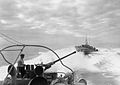 From the bridge of an MTB showing the aft Bofors gun and MTB 378 at speed astern in the Mediterranean.