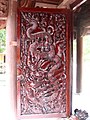 Hình rồng trạm trên cánh cửa Ngũ Long Môn Dragons that are carved in a door of Ngũ Long Môn.