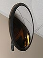 Circular curved mirror in hallway