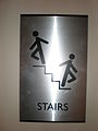 Metal stairs sign with braille