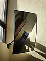 Rectangular curved mirror in stairwell