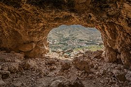 View of the berber village of Snad which lies at the bottom and inside the mountain Orbata in Gafsa