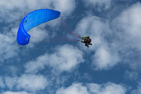 Duo paragliding flight in the puy de Dôme, France.