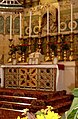 A pre-1969 Latin Rite altar with reredos.