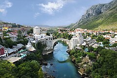 İkinci yer: Stari Most, the "Old Bridge", which connects the two banks of river Neretva, has been a symbol of Mostar for centuries. This view from north shows Helebija tower to the left and Tara tower to the right. It was made from the minaret of Koski Mehmed Pasha Mosque. (POTD) – Credit: Own work by Ramirez. (GFDL, CC-BY-SA-3.0,2.5,2.0,1.0)